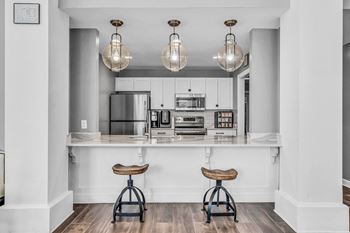 A kitchen with white cabinets